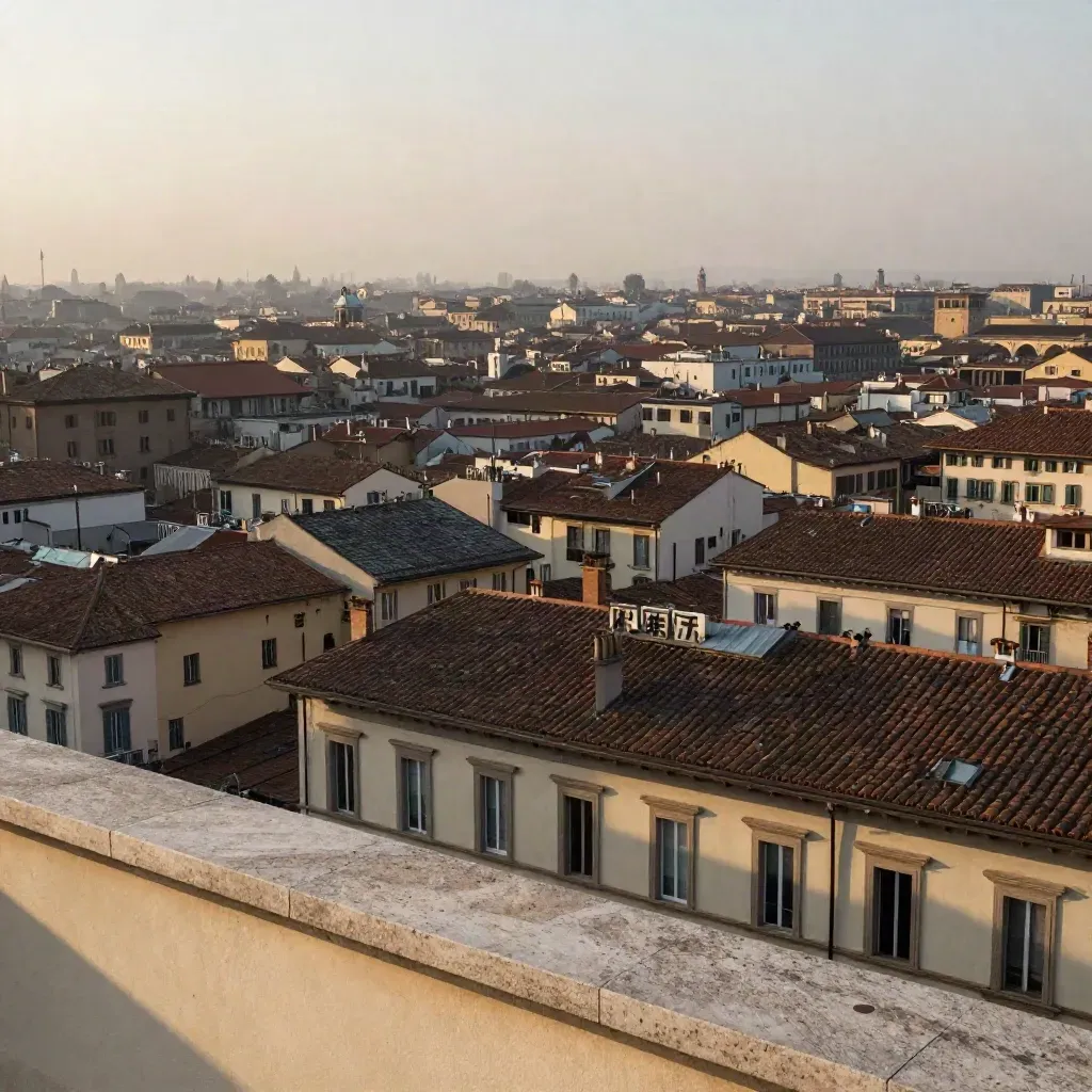 Tetti di Brera con il Duomo lontano avvolto nella foschia serale